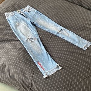 Cropp Woman’s jeans with ripped knees and LOVE patch